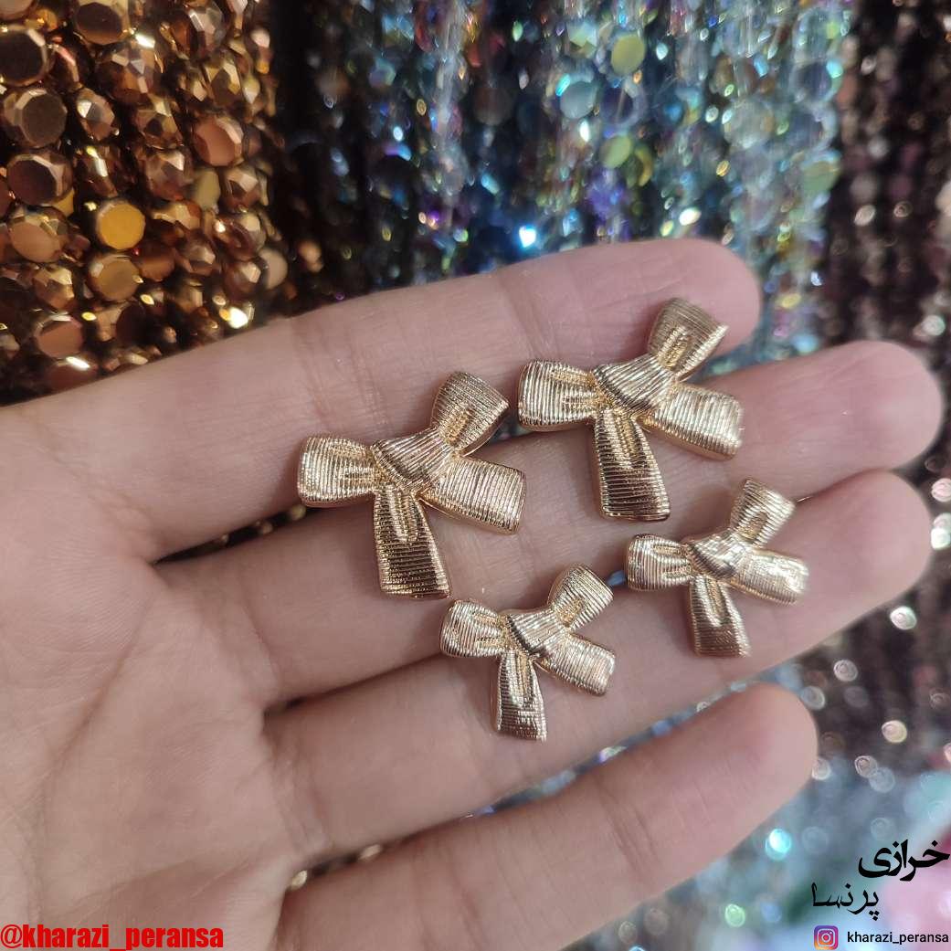 دکمه پینترستی استیل و رنگ ثابت پاپیون طلایی